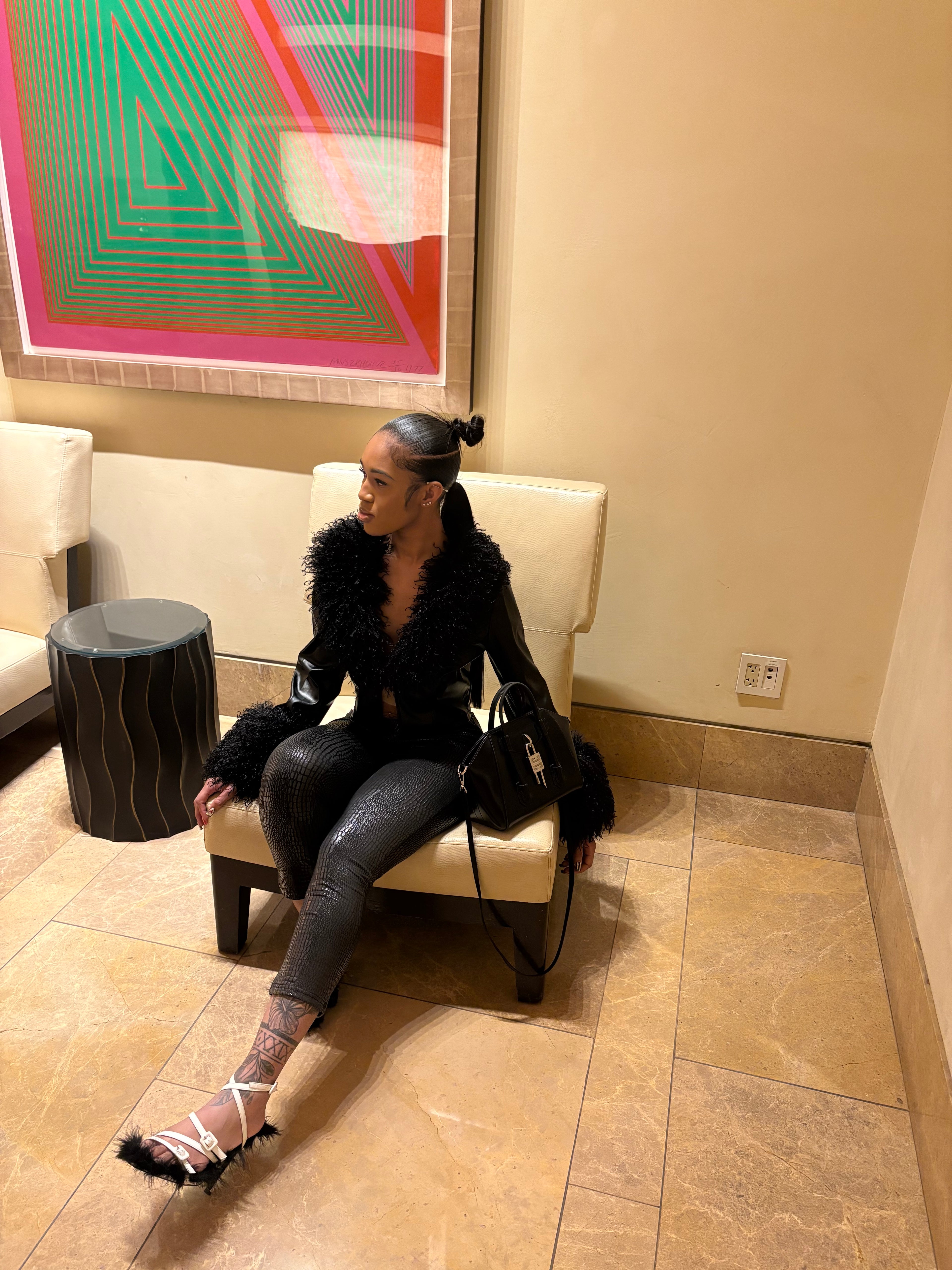 Fur jacket with black leggings