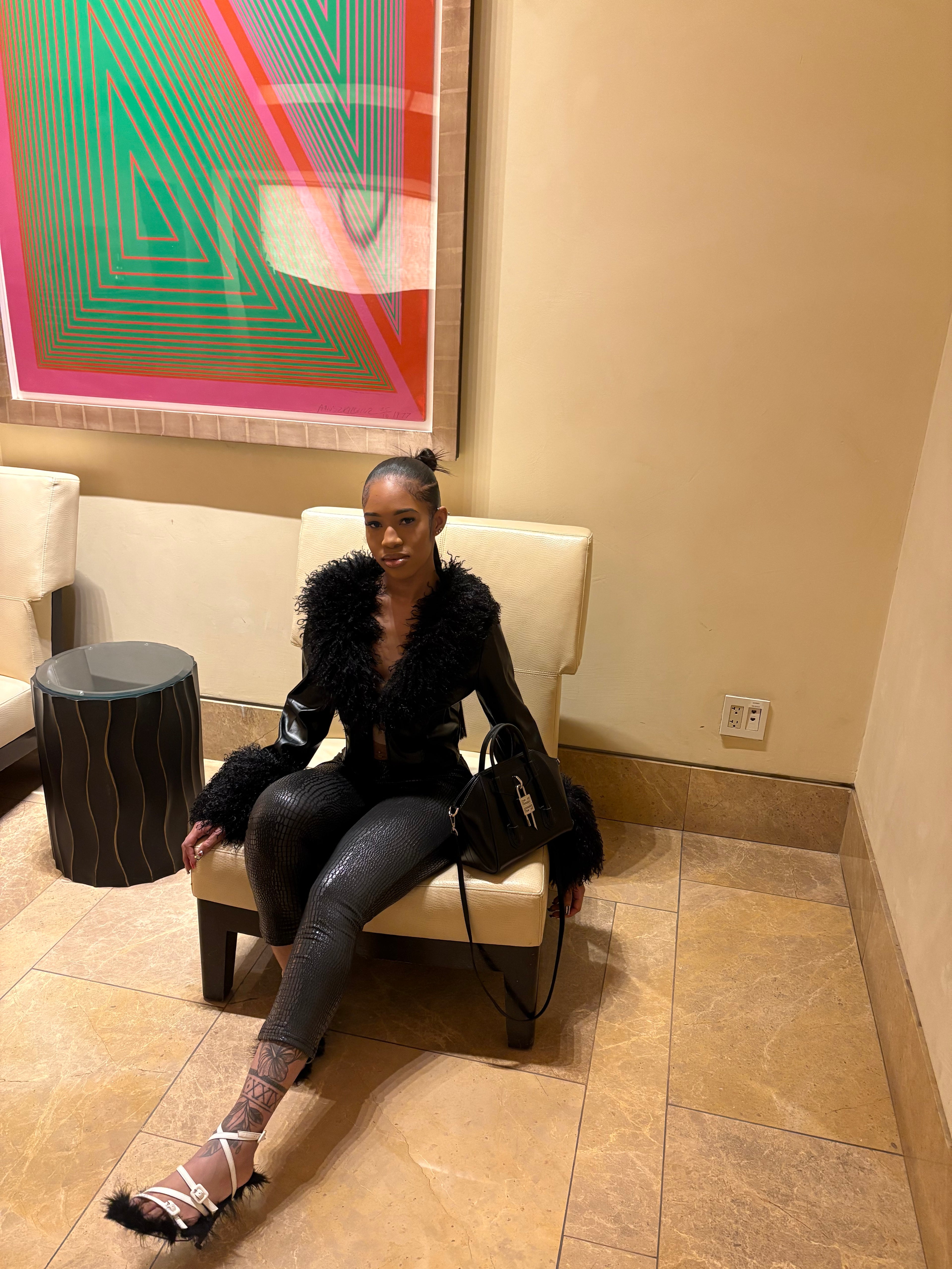 Fur jacket with black leggings