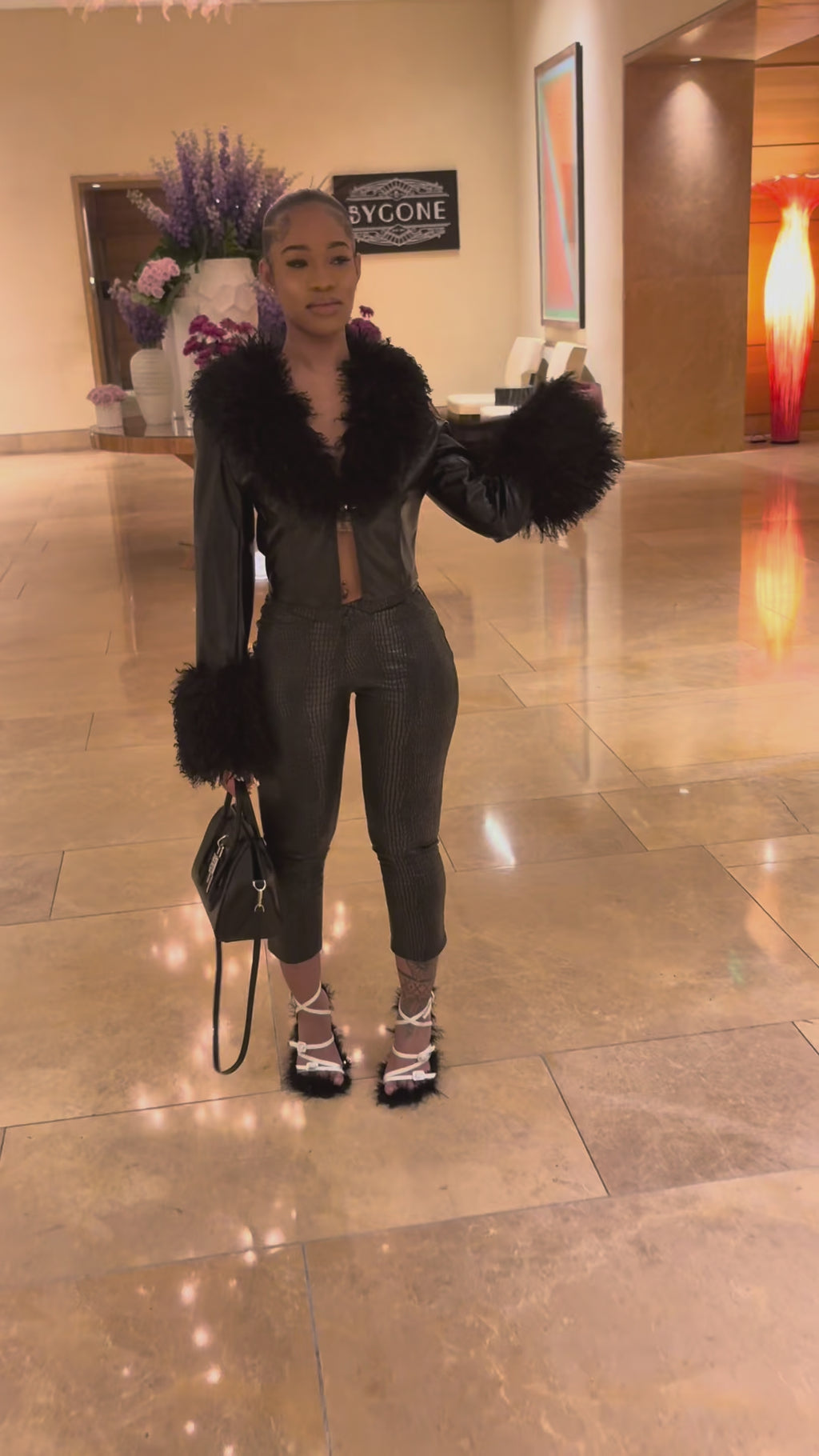 Fur jacket with black leggings
